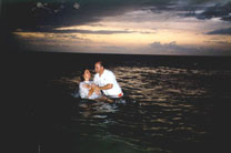 Original night baptism at a beach